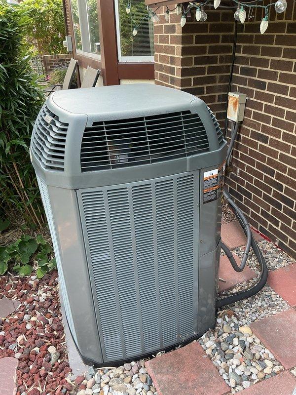 Completed comprehensive Gold AC Inspection on 8-year-old residential air conditioning system. Performed seasonal tune-up on outdoor condenser unit located at rear of property, which included moving obstructions from around compressor for proper access, cleaning condenser coils, inspecting electrical connections, checking refrigerant levels, testing capacitor and contactor operation, verifying proper airflow through louvers, and confirming system operational parameters. Indoor air handler and furnace components inspected for proper integration with cooling system. All components found operating within normal specifications with no deficiencies noted. System tested under load and confirmed to be cooling effectively with no symptoms or concerns reported by customer prior to service.