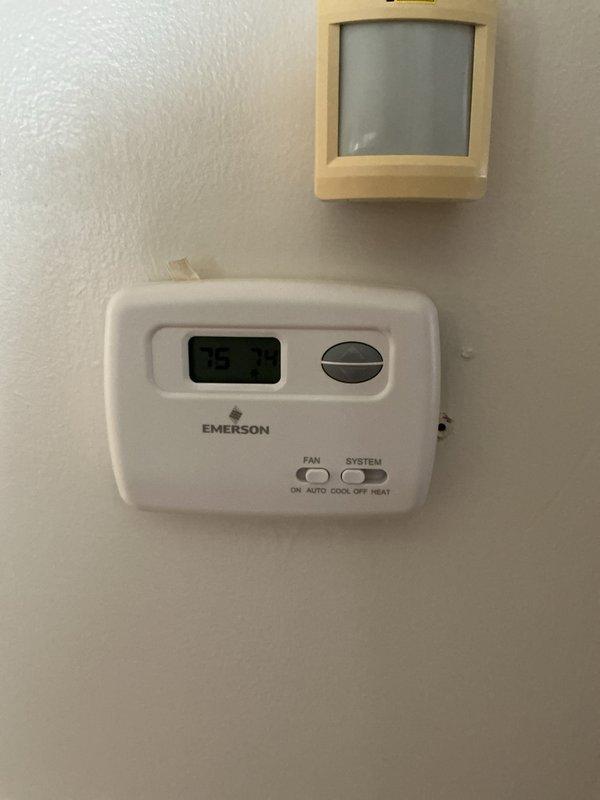 Performed comprehensive AC tune-up on 24-year-old R22 system located in backyard that had been compromised by flood damage and was showing low refrigerant levels. Inspected and serviced all major components including outdoor condenser unit, indoor air handler with ductwork and plenum assembly, condensate drainage system with PVC piping, and Emerson thermostat displaying proper temperature readings. Due to the age of the equipment, obsolete R22 refrigerant, previous flood exposure, and current low refrigerant condition indicating potential leaks, system performance and longevity are significantly compromised and replacement should be considered to ensure reliable cooling and efficiency.