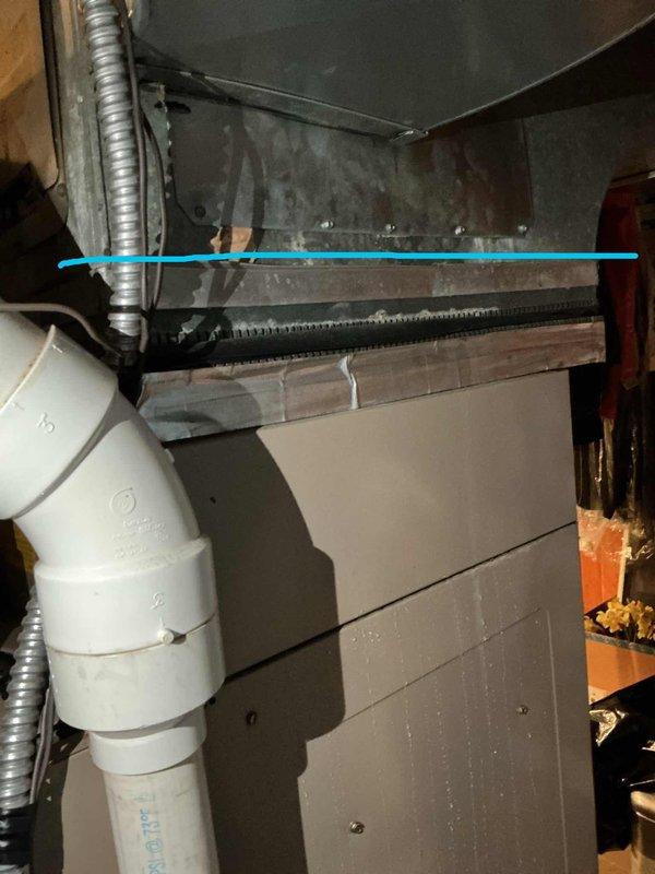 Performed comprehensive AC tune-up on 24-year-old R22 system located in backyard that had been compromised by flood damage and was showing low refrigerant levels. Inspected and serviced all major components including outdoor condenser unit, indoor air handler with ductwork and plenum assembly, condensate drainage system with PVC piping, and Emerson thermostat displaying proper temperature readings. Due to the age of the equipment, obsolete R22 refrigerant, previous flood exposure, and current low refrigerant condition indicating potential leaks, system performance and longevity are significantly compromised and replacement should be considered to ensure reliable cooling and efficiency.