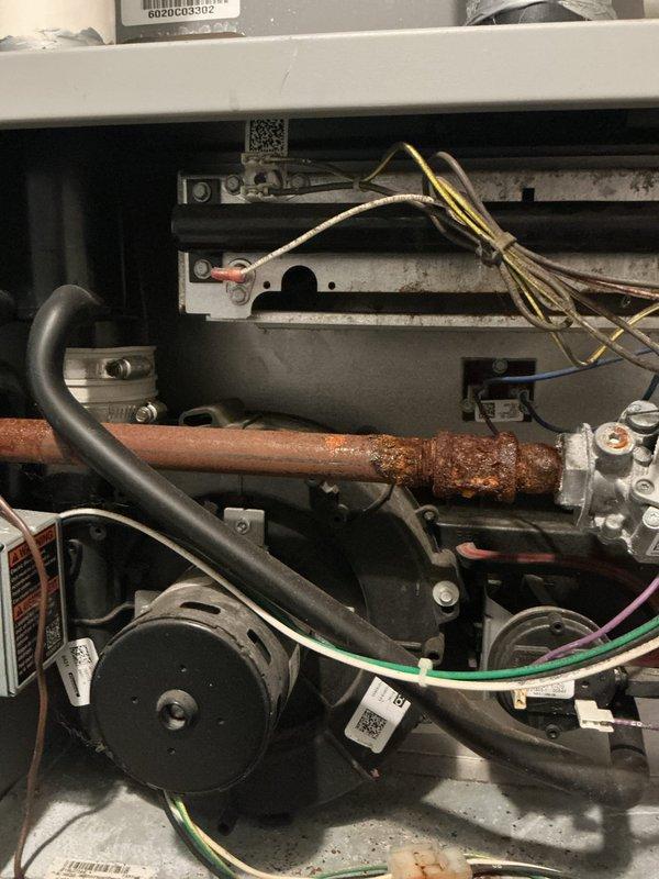 Responded to service call for non-operational furnace and performed comprehensive inspection of both furnace and air conditioning systems located in basement. Upon inspection, discovered significant corrosion on copper refrigerant lines, which was documented with photographs. Verified intake and exhaust venting systems were properly installed and unobstructed on building exterior. Completed full system evaluation of HVAC equipment estimated to be under 10 years old, identifying corroded components requiring attention to prevent future system failures. Customer enrolled in preventative maintenance membership program on-site to ensure ongoing system reliability and performance.