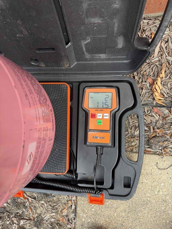 Responded to no cooling complaint on 5-year-old residential air conditioning system. Performed diagnostic evaluation of outdoor condenser unit located at basement level. Utilized digital manifold gauges to measure system pressures and assess refrigerant charge levels. System inspection revealed operational deficiencies requiring technical assessment of compressor function, refrigerant flow, and electrical components to determine root cause of warm air discharge from indoor unit.