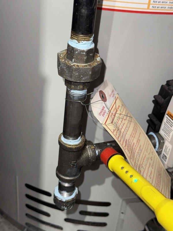 Responded to reported gas leak originating from basement furnace area. Upon inspection with combustible gas detector, identified leak at threaded black iron gas pipe union connection serving the furnace. Applied pipe thread sealant and tightened union fitting to manufacturer specifications. Performed soap bubble test and electronic leak detection to confirm repair integrity, with all connections now testing negative for gas leakage.
