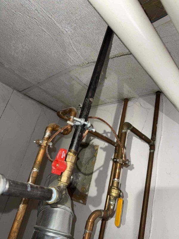 Responded to reported gas leak originating from basement furnace area. Upon inspection with combustible gas detector, identified leak at threaded black iron gas pipe union connection serving the furnace. Applied pipe thread sealant and tightened union fitting to manufacturer specifications. Performed soap bubble test and electronic leak detection to confirm repair integrity, with all connections now testing negative for gas leakage.