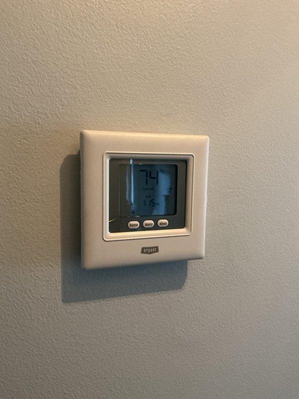 Completed annual Gold Plan maintenance on Lennox air conditioning system with no reported issues. Performed comprehensive tune-up including inspection of outdoor condensing unit, verified thermostat operation displaying 74°F, checked electrical connections and disconnect components, and assessed overall system performance. Unit operating within normal parameters with all components functioning properly.