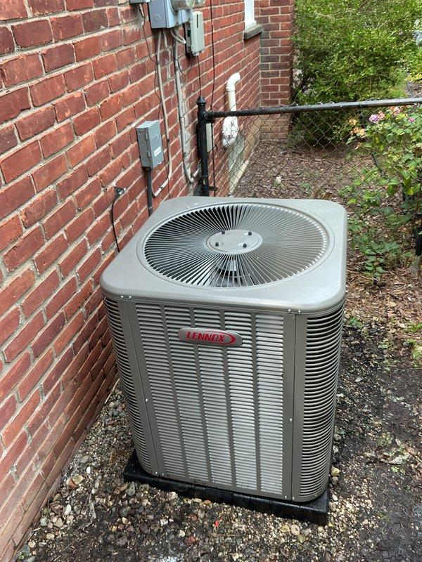 Completed annual Gold Plan maintenance on Lennox air conditioning system with no reported issues. Performed comprehensive tune-up including inspection of outdoor condensing unit, verified thermostat operation displaying 74°F, checked electrical connections and disconnect components, and assessed overall system performance. Unit operating within normal parameters with all components functioning properly.
