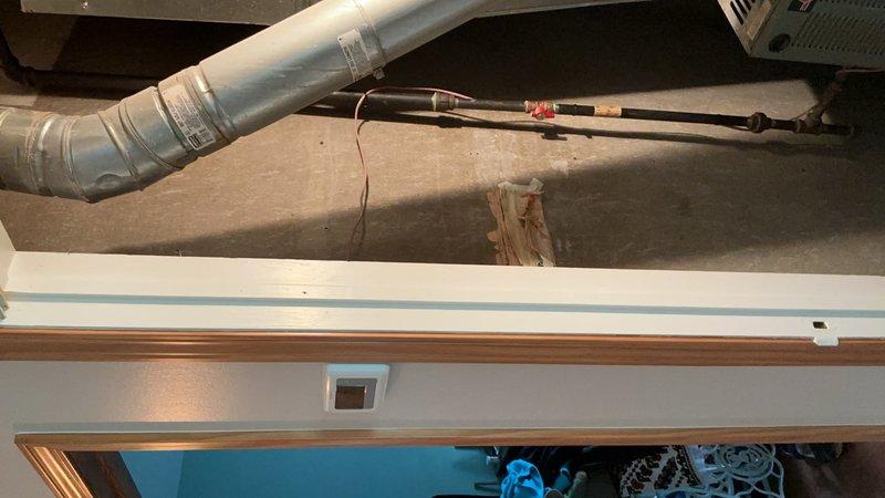 Responded to no communication between thermostat and 25-year-old furnace unit located on main floor. Traced thermostat control wiring through attic space to identify damage reportedly caused during recent construction. Inspected furnace control board connections and verified thermostat wire run from unit through ceiling joists to thermostat location. Located compromised low-voltage wiring in attic area and performed necessary repairs to restore proper communication between thermostat and furnace. Tested system operation and confirmed proper furnace response to thermostat calls for heat.