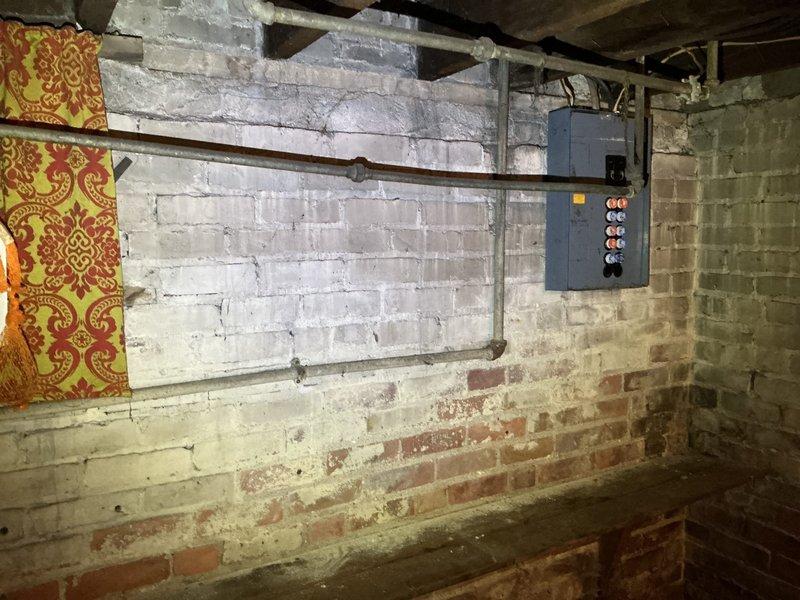 Responded to service call for gas pressure test and multiple reported gas leaks in residential property. Upon inspection of basement gas piping system, identified 10-12 leak points throughout aging gas distribution lines, including corroded pipe connections, deteriorated threaded joints, and compromised fittings on horizontal and vertical runs. Conducted comprehensive pressure test to verify system integrity and locate all leak sources. Documented existing conditions of gas piping infrastructure, noting extensive corrosion on metal pipes, aged hose clamps at connection points, and overall deterioration of mechanical system components. Discussed findings with homeowner and provided recommendations for necessary repairs to restore safe gas system operation and bring installation up to code compliance.