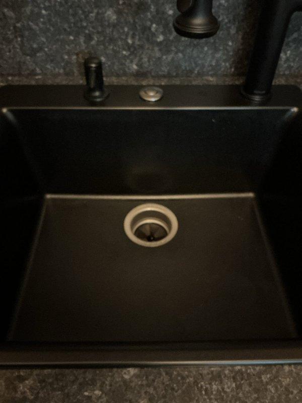 Responded to service call for bathroom sink drainage issue and improper plumbing connections. Upon inspection, found sink drain system required re-piping due to incorrect installation causing blockage and poor water flow. Disconnected existing drain assembly, cleared obstruction from drain line, and properly re-installed sink trap and tailpiece connections ensuring correct pitch and watertight seals. Tested system with running water to verify proper drainage and confirmed no leaks at connection points. All plumbing now functions correctly with proper water flow and drainage.