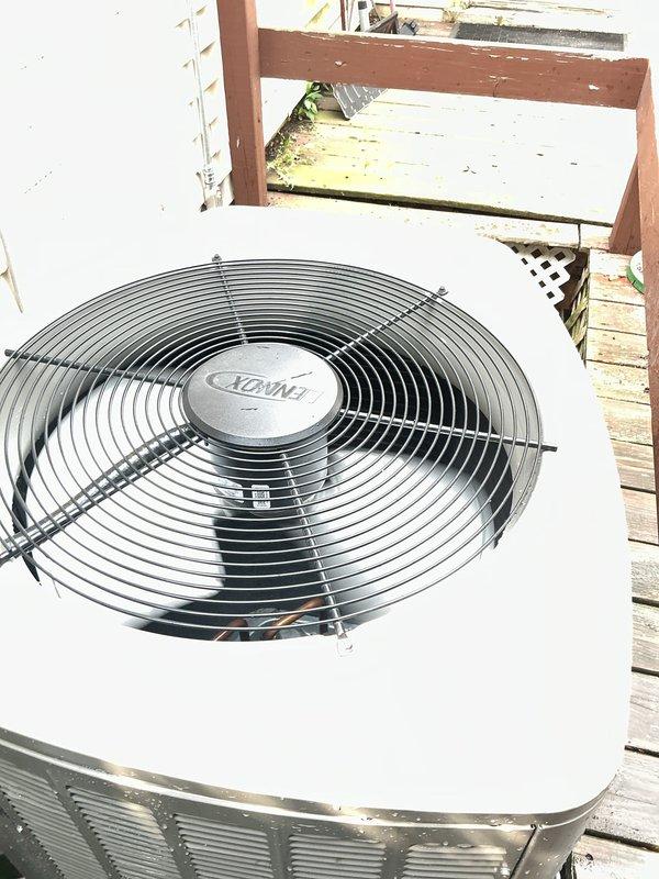 Completed Gold-level preventive maintenance inspection on 1-year-old Lennox furnace and air conditioning system. Performed comprehensive inspection of furnace components including blower assembly, gas valve, heat exchanger, and electrical connections in basement location. Evaluated outdoor condensing unit including fan motor operation and coil condition. Investigated customer concern regarding condensation pump vibration and potential mold growth in discharge line connected to furnace; inspected pump operation and drainage system. Documented equipment condition with photographs showing internal furnace components and exterior AC unit. All systems operational at time of inspection.