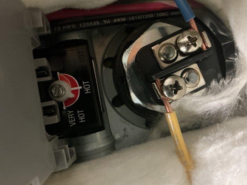Responded to warranty call for newly installed 50-gallon tanked water heater with no hot water delivery throughout residence. Performed diagnostic testing on water heater electrical components and heating elements using digital multimeter to verify power supply and element continuity. Inspected terminal connections, wiring configuration, and thermostat settings on unit installed less than 30 days prior. Adjusted factory default temperature settings on upper and lower thermostats to proper operational parameters. Verified proper voltage at heating element terminals and confirmed all electrical connections were secure and properly torqued. System restored to full operational status with adequate hot water production for household demand.