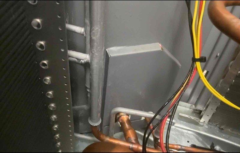 Performed return visit to conduct leak search on 2-month-old AC system experiencing cooling failure with fan-only operation. Replaced defective zone motors at basement and backyard equipment locations. Inspected refrigerant lines, electrical connections, and ductwork components; awaiting parts for duct whistle noise resolution.