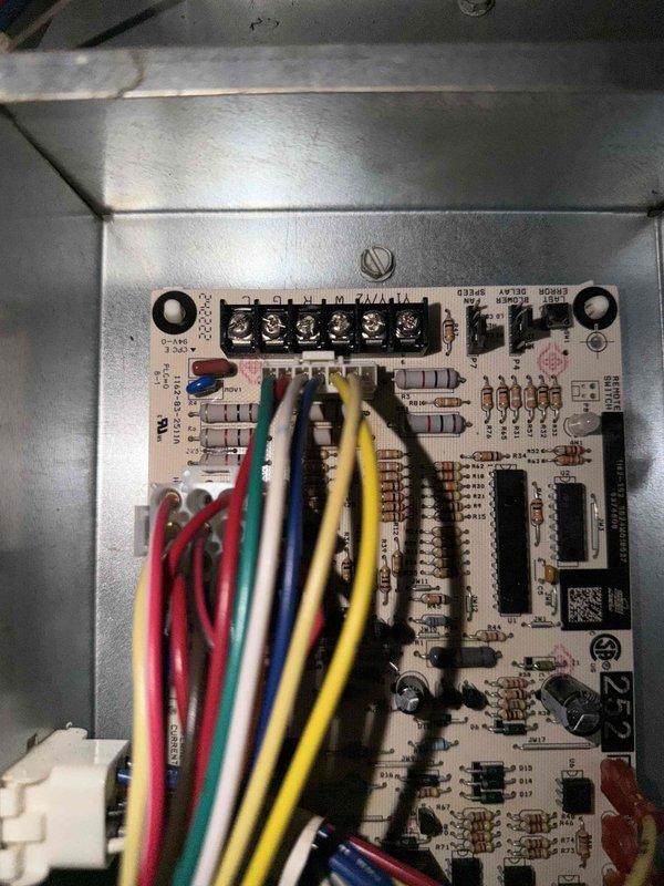 Responded to no-cooling call on 1-year-old residential air conditioning system located at rear of property. Upon arrival, confirmed indoor blower fan was not operating. Inspected outdoor condensing unit and found exterior surfaces heavily soiled with dirt and grime accumulation affecting airflow efficiency. Accessed control board within unit and performed electrical diagnostics on all low-voltage connections and relay operations. Verified proper voltage at terminal strip and tested all thermostat wire connections including R, C, Y, G, and W terminals. Cleaned condenser coil surfaces and removed debris from unit exterior. System restored to proper operation with indoor blower fan running correctly. Discussed filter replacement needs with occupant and processed membership plan renewal request.