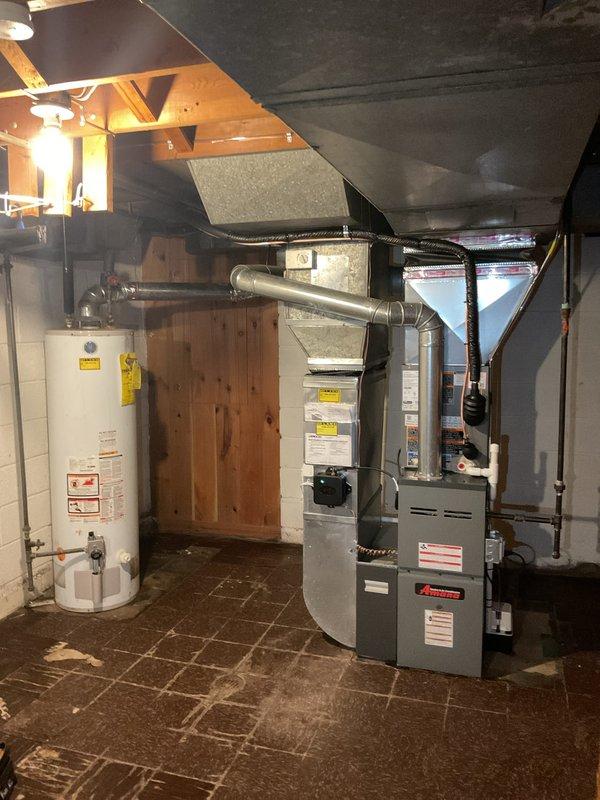 Completed installation of 2-ton air conditioning system with matching evaporator coil in rear yard location. Installed Ecobee 3 Lite smart thermostat and condensate pump in basement mechanical room, connected to existing furnace and ductwork. Obtained mechanical, electrical, and air conditioning permits prior to installation, performed system startup, verified proper refrigerant charge and airflow, and reconnected all electrical connections per code requirements.