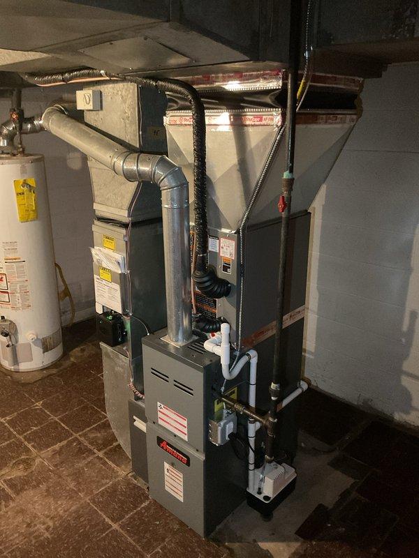 Completed installation of 2-ton air conditioning system with matching evaporator coil in rear yard location. Installed Ecobee 3 Lite smart thermostat and condensate pump in basement mechanical room, connected to existing furnace and ductwork. Obtained mechanical, electrical, and air conditioning permits prior to installation, performed system startup, verified proper refrigerant charge and airflow, and reconnected all electrical connections per code requirements.