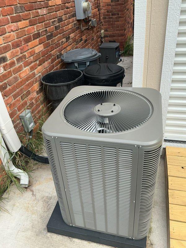 Responded to no cooling call on residential split system with 1-year-old outdoor condenser and 2-year-old attic air handler. Upon arrival, verified thermostat was calling for cooling with display showing 73°F setpoint. Inspected outdoor unit located in backyard on concrete pad and confirmed unit was not operating. Checked electrical connections at disconnect and verified 240V power supply present at condenser. Tested contactor and found failed contacts preventing compressor and condenser fan operation. Replaced defective contactor with OEM equivalent part. Cycled system through multiple cooling cycles to verify proper operation of compressor, condenser fan motor, and overall system performance. Confirmed adequate airflow at indoor registers and proper temperature split across evaporator coil. System restored to normal cooling operation with all components functioning as designed.