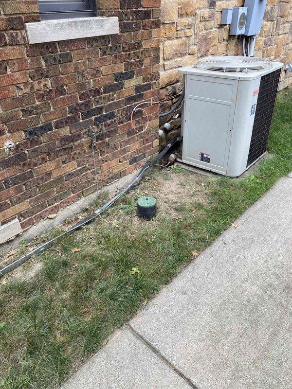 Provided estimate for replacement of existing 15+ year-old SpacePak high-velocity air conditioning system with new Unico small-duct HVAC system. Customer currently utilizes boiler for heating and seeks to upgrade cooling distribution while maintaining minimal visual impact of ductwork. Assessed existing outdoor condensing unit, refrigerant line set routing along exterior brick wall, electrical disconnect, and interior electrical panel to determine compatibility and installation requirements for proposed Unico system replacement.