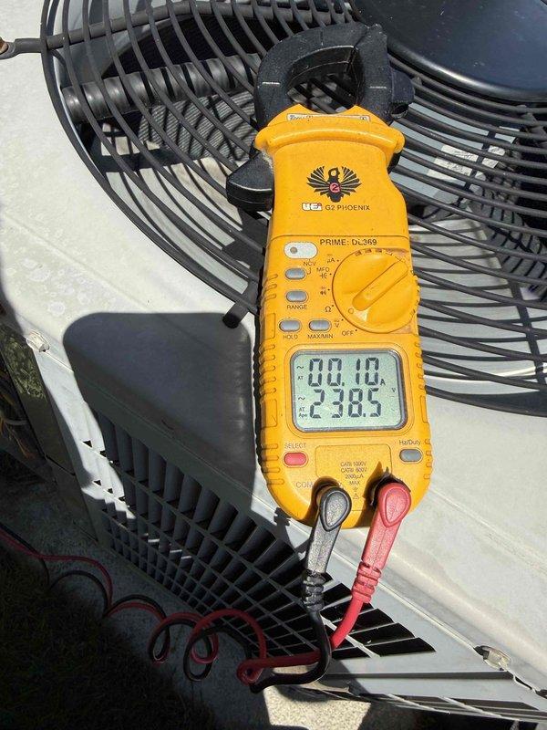 Completed comprehensive Gold AC Inspection on 20-year-old air conditioning system located in basement. Performed electrical diagnostics on outdoor condensing unit using digital multimeter, verifying voltage readings at 238.5V and confirming proper electrical operation. Inspected condenser fan motor, fan guard assembly, and all accessible components of the outdoor unit for operational integrity. Examined indoor plumbing connections, shut-off valves, and associated HVAC infrastructure. Applied energy efficiency identification tag to system piping for future reference. Replaced humidifier pad on furnace as requested during service visit. All systems operating within normal parameters at time of inspection.