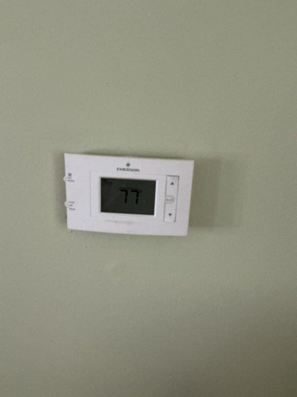 Responded to service call for air conditioning system that would not stay on despite thermostat battery replacement. Evaluated 10+ year old cooling system located in basement and assessed Emerson digital thermostat functionality. Provided comprehensive full system estimate for equipment replacement options based on age of existing unit and operational failures.
