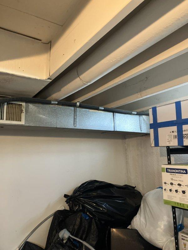 Responded to service call for air conditioning system not cooling and blowing warm air with thermostat stuck at 82°F. Upon arrival, found outdoor unit running continuously for 24 hours. Performed comprehensive system diagnostic on basement-located HVAC equipment. Inspected indoor air handler, ductwork distribution system, and associated components. Evaluated existing galvanized ductwork configuration and equipment condition. Documented system age and current operational status through visual inspection and photography. Prepared and presented full system replacement estimate to customer. Customer required completion of estimate prior to 4 PM work commitment and requested text communication due to phone calls showing as spam.