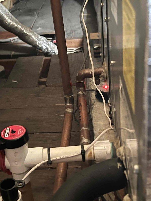 Responded to service call for Unico air handler system serving second and third floors that was not operating. Upon arrival, accessed third-floor equipment location and inspected air handler unit manufactured in 2017 or earlier. Examined flexible ductwork installation in attic space, verifying proper securing and connections of supply ducts. Traced refrigerant lines and inspected copper piping connections throughout system, checking for proper insulation and potential leak points. Evaluated mechanical room components including ductwork routing and system infrastructure. Performed diagnostic assessment of air handler operation, electrical connections, and airflow distribution to affected zones.