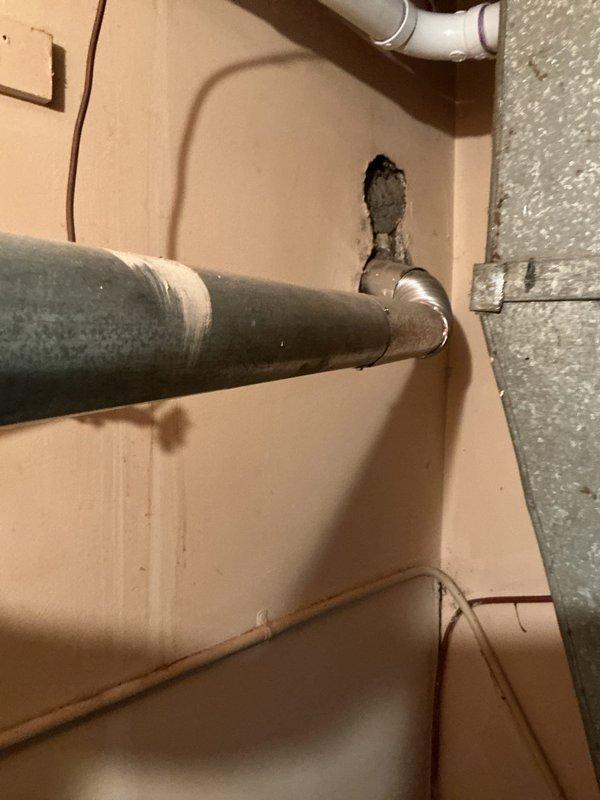 Installed a 40-gallon tank-style water heater in residential utility closet. Connected hot and cold water copper supply lines to unit, installed aluminum exhaust vent ducting to existing black insulated vent pipe, and verified proper clearances from adjacent HVAC equipment. All connections tested and operational upon completion.