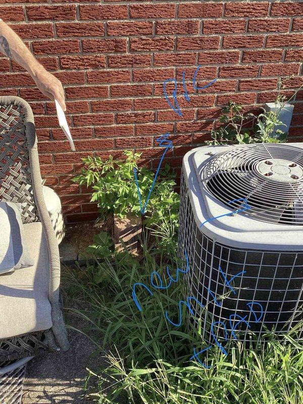 Conducted comprehensive assessment of existing heating and cooling system for replacement estimate at small residential property (0-1500 sq.ft.). Evaluated current dual outdoor condenser units positioned on concrete pad against exterior brick wall, noting refrigerant line routing and existing infrastructure. Inspected basement-mounted natural gas furnace installation and assessed ductwork configuration. Reviewed interior climate control setup including existing Emerson digital thermostat displaying current temperature settings. Documented equipment specifications, system capacity requirements, and spatial constraints for proposed HVAC replacement to provide accurate equipment sizing and installation recommendations for new heating and air conditioning system.