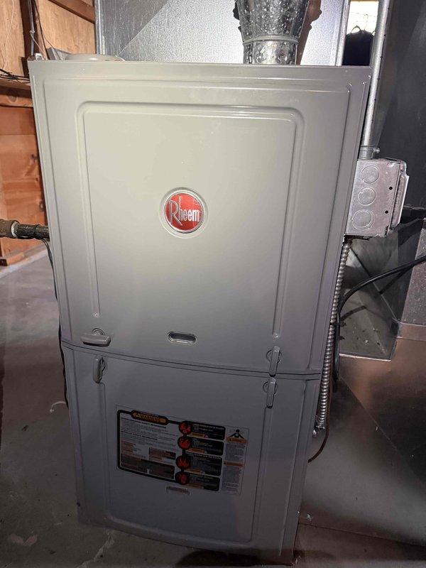 Responded to no cooling call on 2001 Rheem forced air system located in basement. Customer reported air conditioning failure after attempting to install Nest thermostat using only 3 of 5 available wires, then reinstalling original thermostat without success. Upon arrival, inspected control board wiring and thermostat connections at unit. Verified proper wire terminations at furnace control board terminal strip and traced low voltage circuit. Identified improper thermostat wire connections resulting from DIY installation attempt. Reconnected thermostat wiring to appropriate terminals per manufacturer specifications, ensuring all five conductors were properly landed. Restored power to unit and verified 24VAC control voltage present. Cycled system through heating and cooling modes to confirm proper operation of compressor, blower motor, and reversing valve. System returned to normal operation with no further issues observed.