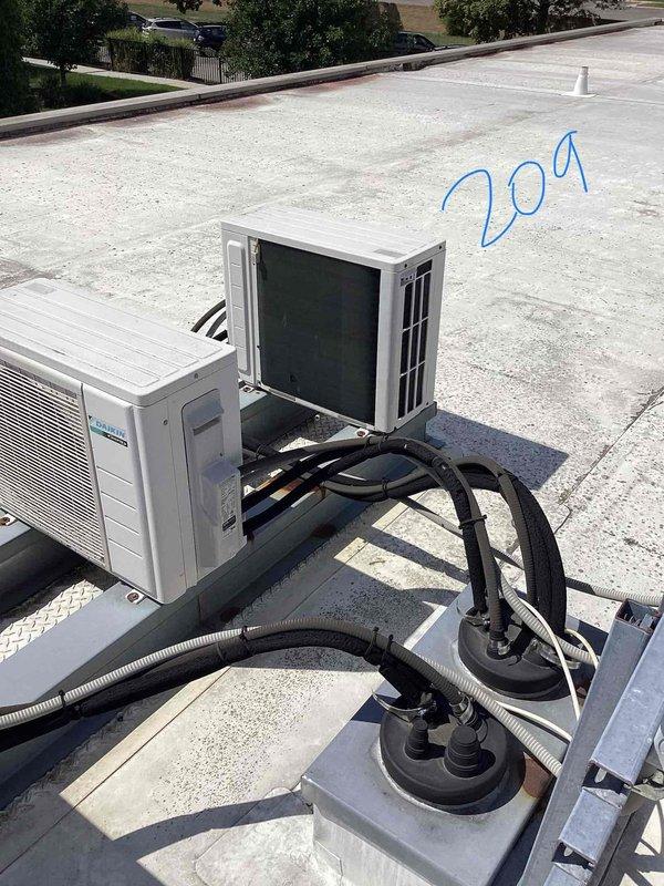 Completed comprehensive assessment of two Daikin mini-split systems installed in 2013 at a nursing home facility, with units serving room 306 and room 209. Performed rooftop inspection of outdoor condensing units, documenting existing equipment conditions, refrigerant line routing, electrical connections, and mounting configurations to provide accurate replacement estimate for aging HVAC equipment approaching end of serviceable life.