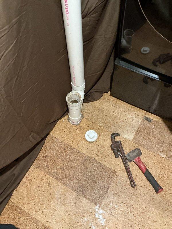 Responded to a blockage occurring between the main line inside the residence and the exterior sewer connection. Accessed the cleanout located in the basement and successfully cleared the obstruction using professional drain cleaning equipment. Removed the cleanout cap from the white PVC pipe assembly, performed thorough augering of the affected line, and verified proper drainage flow was restored. Reinstalled cleanout cap and confirmed system was functioning correctly with no further blockages present.