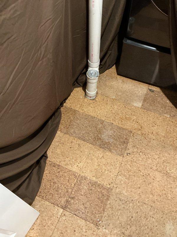 Responded to a blockage occurring between the main line inside the residence and the exterior sewer connection. Accessed the cleanout located in the basement and successfully cleared the obstruction using professional drain cleaning equipment. Removed the cleanout cap from the white PVC pipe assembly, performed thorough augering of the affected line, and verified proper drainage flow was restored. Reinstalled cleanout cap and confirmed system was functioning correctly with no further blockages present.