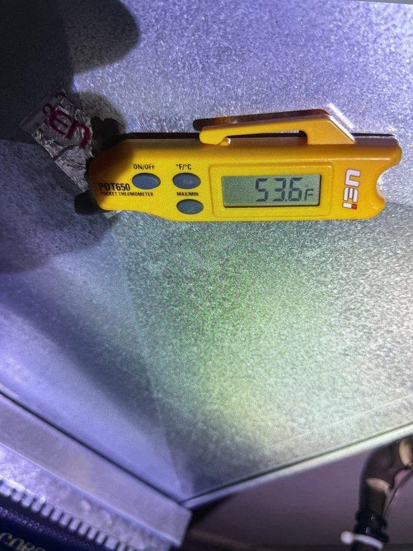 Completed warranty follow-up on recently installed 5-ton air conditioning system with uncased coil located in left side yard. System was experiencing short cycling every 20 minutes and failing to reach setpoint temperature. Verified proper operation of new equipment, confirmed thermostat programming and scheduling functions operating correctly. Measured and documented supply air temperature at 53.5°F, indicating adequate cooling performance. System now maintaining desired temperature without short cycling issues.