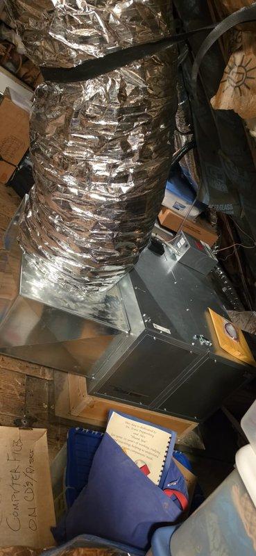 Completed replacement of Unico air handler system in attic space over two-day period. Removed existing equipment and installed new air handler unit, securing it to wooden structural framing with proper mounting. Connected flexible aluminum ductwork to unit with appropriate strapping and sealed connections. Ran refrigerant lines including copper piping from air handler, installed black flexible conduit for electrical connections, and reconnected all necessary wiring to complete mechanical installation. Mechanical permit requested for air handler reconnection work. All components installed per manufacturer specifications and positioned to optimize available space within attic structure.