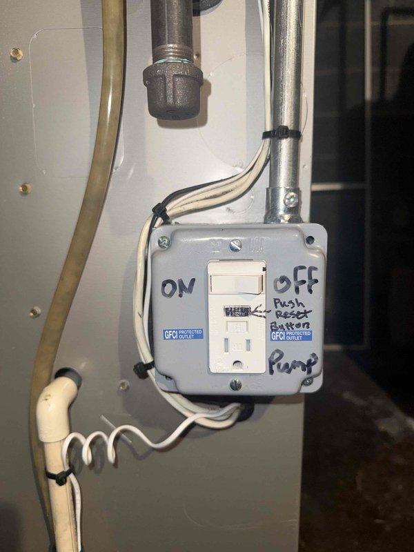 Responded to no cooling complaint on 10+ year old AC unit located in basement. Upon arrival, found condensate pump not operating, preventing AC system from running due to safety float switch activation. Inspected GFCI-protected outlet supplying power to pump and discovered circuit had tripped. Reset GFCI receptacle, restored power to condensate pump, and verified proper pump operation and drainage. Tested AC system operation and confirmed unit cooling normally with proper airflow from indoor blower. Advised homeowner to monitor GFCI outlet for future trips, which may indicate pump motor drawing excessive current or potential ground fault condition requiring pump replacement.