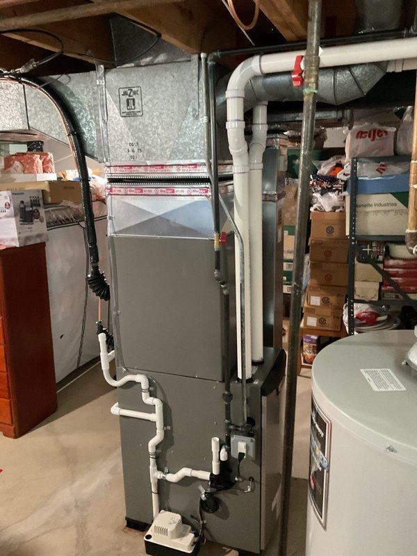 Completed full HVAC system installation including 70,000 BTU furnace and 3.5-ton air conditioning unit in basement with outdoor condenser placement in rear yard. Installed new thermostat, humidifier, and reconnected existing ductwork to new equipment. Performed refrigerant charging and system commissioning with digital manifold gauges, verifying proper superheat and subcooling values, temperature differentials, and overall system performance within manufacturer specifications. Requested and coordinated mechanical and electrical permits for installation compliance.