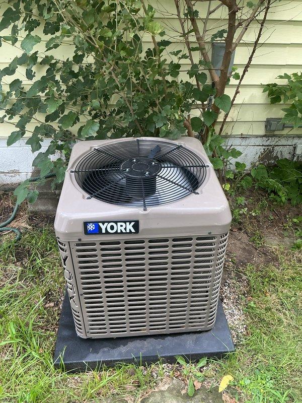 Responded to service call for reduced cooling performance on 4-year-old YORK air conditioning system. Performed diagnostic inspection of outdoor condensing unit and indoor components. Verified unit operation, checked refrigerant levels, and inspected electrical connections. Examined evaporator coil located in crawlspace for airflow restrictions or debris accumulation. Assessed system performance against manufacturer specifications. Unit found to be operating within normal parameters with active warranty coverage noted. Provided homeowner with maintenance recommendations to optimize system efficiency and cooling output.