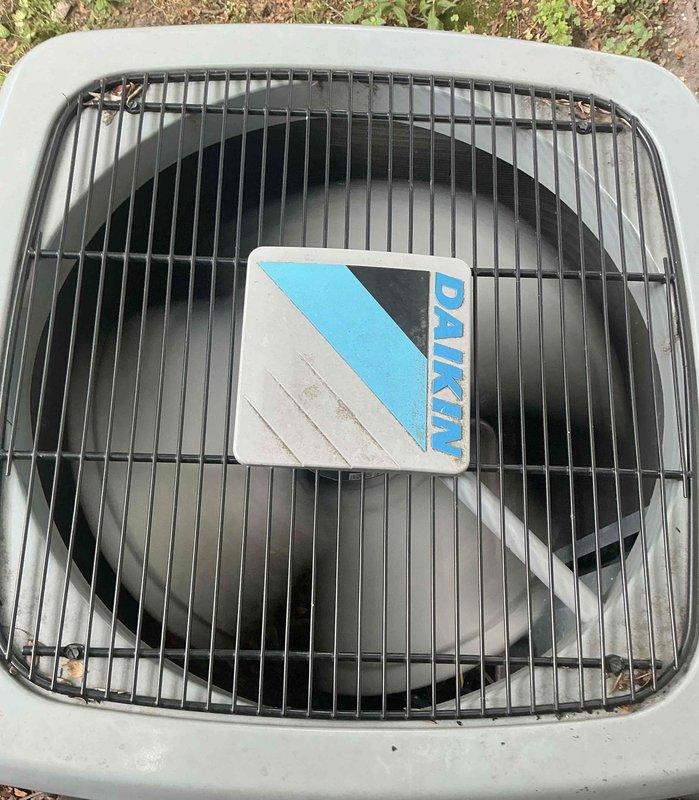 Responded to service call for 6-year-old Daikin mini-split system with reported condensation leak at PVC penetration point and abnormal furnace noises. Performed diagnostic inspection of outdoor condensing unit and indoor air handler components. Inspected contactor assembly and electrical connections for proper operation. Evaluated condensate drain line routing and furnace operation to identify source of moisture accumulation and unusual sounds. Documented equipment condition with photos of condensing unit and contactor for service records.
