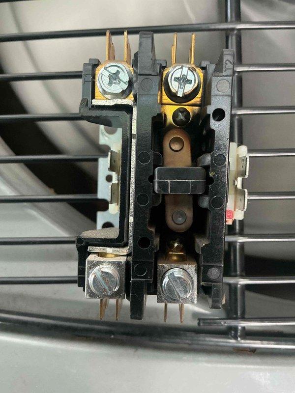 Responded to service call for 6-year-old Daikin mini-split system with reported condensation leak at PVC penetration point and abnormal furnace noises. Performed diagnostic inspection of outdoor condensing unit and indoor air handler components. Inspected contactor assembly and electrical connections for proper operation. Evaluated condensate drain line routing and furnace operation to identify source of moisture accumulation and unusual sounds. Documented equipment condition with photos of condensing unit and contactor for service records.