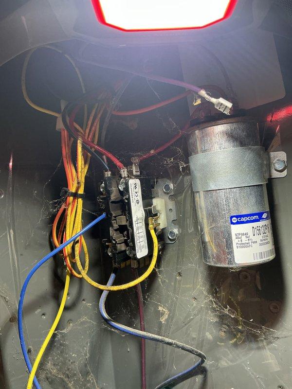 Responded to service call for A/C unit continuously running without shutting off on 15-20 year old system located near kitchen. Upon inspection, found significant dirt and debris buildup throughout unit and identified failed contactor as primary issue preventing system from cycling properly. Replaced defective contactor, cleaned accumulated debris from control panel and capacitor area, verified all electrical connections, and tested system operation to confirm proper cycling and shutdown functionality restored.