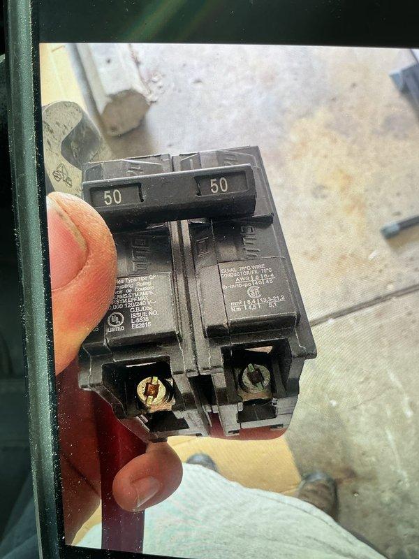 Responded to service call for breaker tripping issues on HVAC unit. Upon inspection, confirmed 50-amp double-pole circuit breaker was experiencing excessive heat buildup despite normal amp draw from equipment (compressor at 9.6 amps, fan motor at 1.2 amps, well below 50-amp rating). Verified all electrical connections at disconnect and unit were secure with no loose terminals or damaged conductors. Determined breaker itself was faulty and replaced defective 50-amp double-pole circuit breaker with new unit. Restored power to system and verified proper operation with no overheating conditions present.