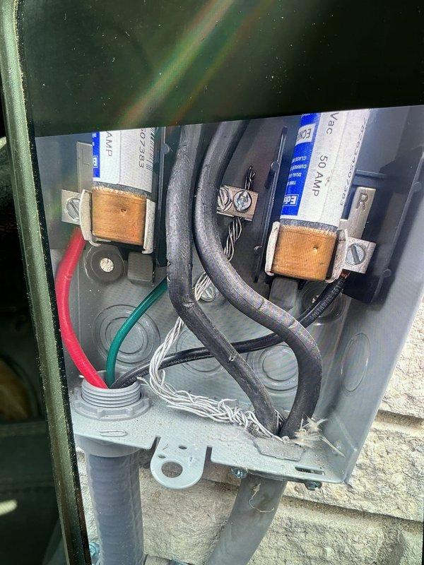 Responded to service call for breaker tripping issues on HVAC unit. Upon inspection, confirmed 50-amp double-pole circuit breaker was experiencing excessive heat buildup despite normal amp draw from equipment (compressor at 9.6 amps, fan motor at 1.2 amps, well below 50-amp rating). Verified all electrical connections at disconnect and unit were secure with no loose terminals or damaged conductors. Determined breaker itself was faulty and replaced defective 50-amp double-pole circuit breaker with new unit. Restored power to system and verified proper operation with no overheating conditions present.