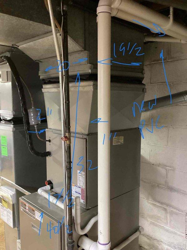 Conducted comprehensive assessment of existing HVAC system in basement mechanical room, including furnace of unknown age and 2017 air conditioning unit. Performed detailed measurements and markings throughout installation area on concrete block walls, existing PVC piping, and equipment to prepare replacement specifications. Evaluated current thermostat operation and documented need for new wireless thermostat installation as part of system upgrade recommendations.