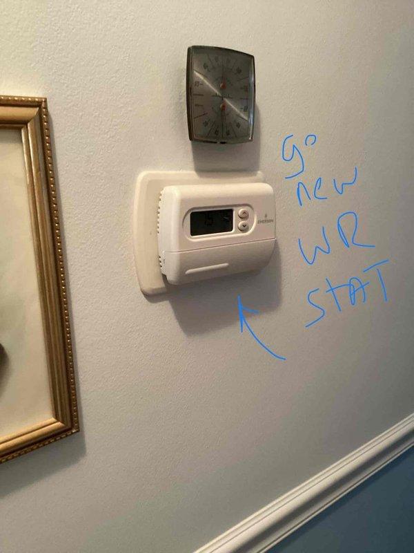 Conducted comprehensive assessment of existing HVAC system in basement mechanical room, including furnace of unknown age and 2017 air conditioning unit. Performed detailed measurements and markings throughout installation area on concrete block walls, existing PVC piping, and equipment to prepare replacement specifications. Evaluated current thermostat operation and documented need for new wireless thermostat installation as part of system upgrade recommendations.