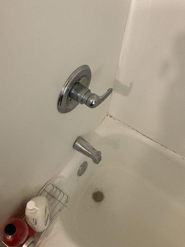 Responded to service call for shower head replacement in residential bathroom. Upon arrival, assessed existing chrome tub and shower fixtures mounted above bathtub. Removed old shower head assembly and installed new chrome shower head unit, ensuring proper connection to existing plumbing infrastructure. Tested water flow and pressure through new fixture to verify proper operation and checked for leaks at all connection points. All fixtures functioning correctly upon completion.