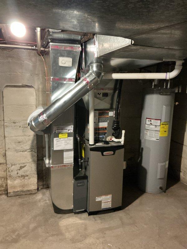 Completed full HVAC system replacement in residential basement, installing new 45,000 BTU furnace and 1.5 ton air conditioning unit. Installed Ecobee 3 Lite smart thermostat for enhanced climate control and programming capabilities. Mounted new furnace with proper venting system, including metallic ductwork and exhaust piping routed through existing infrastructure. Connected air handler plenum to furnace with secure ductwork transitions, ensuring proper airflow distribution throughout residence.

Ran and insulated copper refrigerant lines from indoor air handler to outdoor condensing unit located in rear yard, with professional line set installation and proper insulation to prevent condensation. Installed condensate drain system using PVC piping for efficient moisture removal from system. Reconnected all existing ductwork to new equipment with proper sealing and metallic tape application at all joints to prevent air leakage.

Integrated humidifier into system for whole-home humidity co