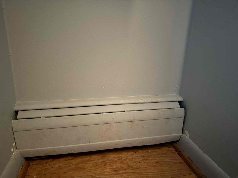 Returned to property to complete installation of register covers following previous boiler repiping work. Installed baseboard heating register covers in multiple rooms throughout the residence, ensuring proper fit and secure mounting. All covers were properly positioned over the baseboard heating units and verified for adequate airflow clearance.
