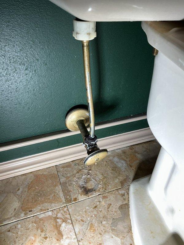 Completed comprehensive whole home plumbing inspection for new homeowner. Inspected all accessible plumbing fixtures, supply lines, drain assemblies, and shut-off valves throughout the residence. Identified non-functional drain stopper mechanism in bathroom sink and noted excessive noise during bathtub water flow, likely caused by inadequate venting or drain line restrictions. Documented bathroom plumbing configuration including under-sink P-trap assembly with plastic tailpiece and PVC connections, braided stainless steel supply lines, and toilet water supply with brass angle stop valve. Observed evidence of previous water exposure on bathroom flooring near toilet shut-off valve area with visible staining on travertine tile surface, indicating potential historical leak or condensation issue. Photographed relevant plumbing components for documentation and customer reference. Provided detailed quote for necessary repairs including drain stopper replacement and investigation of bathtub dr