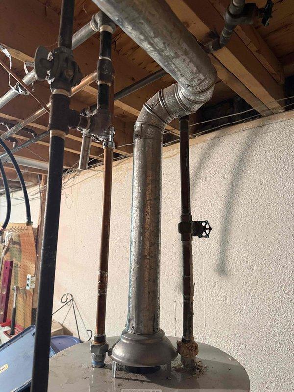 Returned to property to replace defective B-Vent Wye fitting that had developed a hole in the basement utility area. The damaged Wye was removed from the vertical vent pipe system and replaced with new fitting obtained from shop inventory. Upon completion, verified proper fit and seal of new B-Vent Wye connection to ensure safe venting operation for the one-year-old HVAC system.