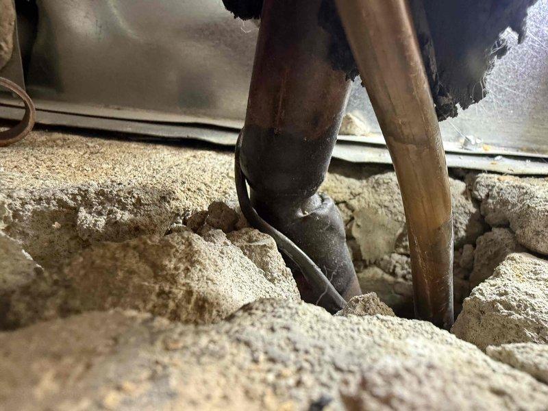 # HVAC Condensate Pump Installation

Responded to service call for condensate drainage system installation in crawl space area. Upon inspection, identified need for condensate pump assembly to handle HVAC unit drainage. Installed new condensate pump with appropriate tubing to route condensate water away from unit and prevent water damage to surrounding structure. Connected pump to dedicated GFI-protected electrical circuit for safe operation in moisture-prone environment. Routed discharge tubing through crawl space insulation to designated drainage point. Tested pump operation and verified proper cycling and drainage flow. System now effectively removes condensate water from HVAC unit, preventing overflow and protecting foundation area from moisture accumulation.