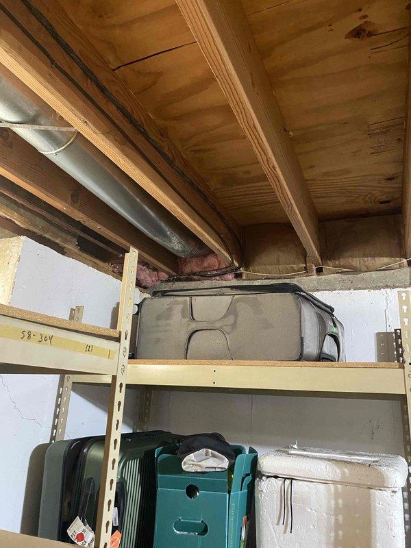 Conducted on-site estimate for new mini split installation in garage area of property currently under construction or renovation. Assessed electrical panel capacity and available circuits, evaluated optimal placement for indoor and outdoor unit components considering exposed framing and unfinished walls, and determined routing requirements for refrigerant lines, condensate drainage, and electrical connections in space with exposed ceiling joists and OSB sheathing.