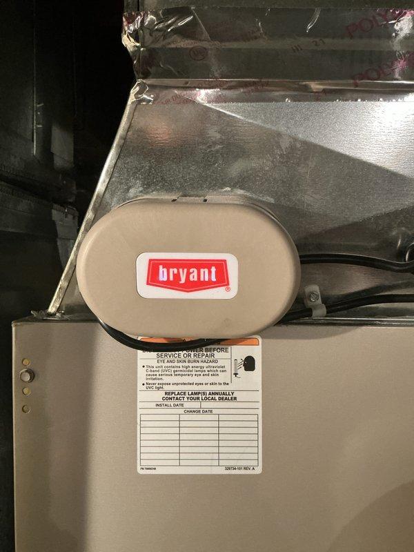 Completed comprehensive Gold-level AC inspection on 4-year-old Bryant system with coil located in basement. Inspected air handler unit, verified proper operation of condensate drainage system with safety switches, examined ductwork condition noting some material deterioration at plenum connections, and documented all equipment labels and maintenance records. All system components operational at time of inspection.